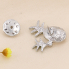 Pin's broche X2 ananas cristaux, strass et métal 0623502 argenté