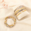 12 bracelets élastiques cristal facetté perles nacrées billes acier 0226114 jaune